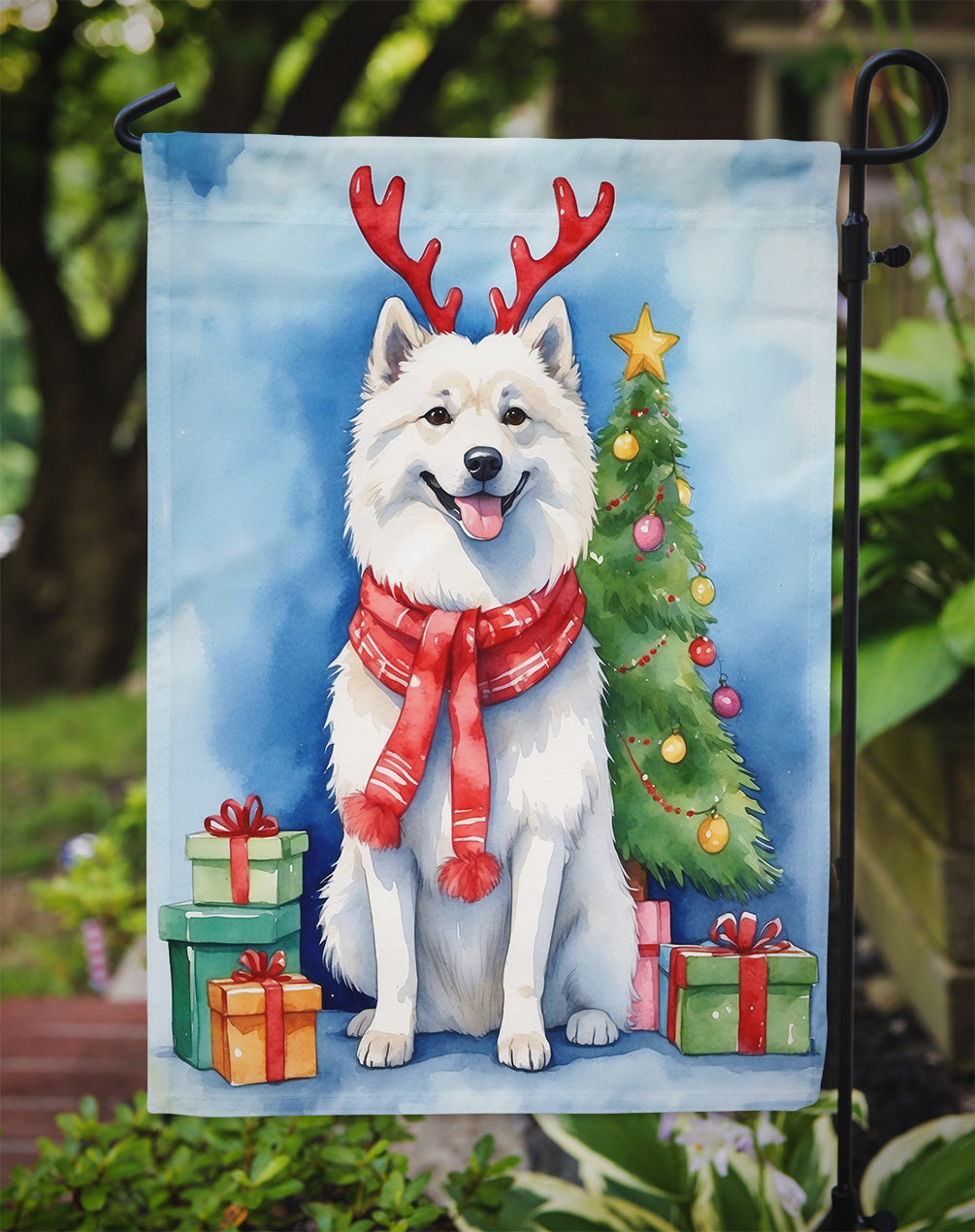 American Eskimo Christmas Garden Flag – Dog in Reindeer Antlers with Tree & Gifts