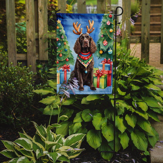American Water Spaniel Christmas Garden Flag – Dog in Reindeer Antlers with Tree & Gifts